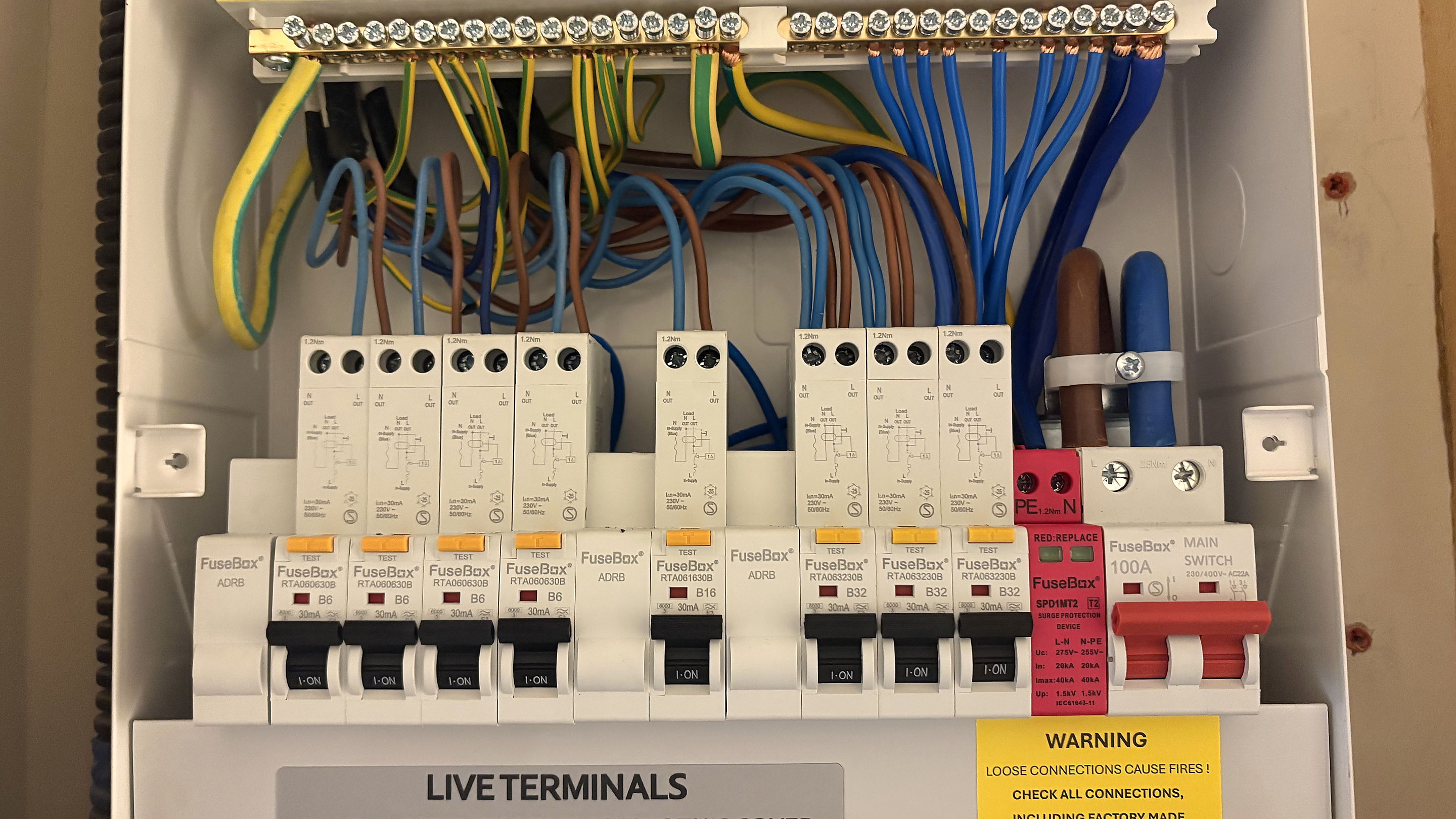 Consumer unit with the cover off and every circuit wired and connected